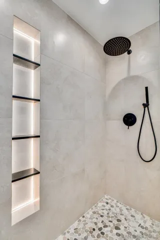 a bathroom with a sink toilet and shower