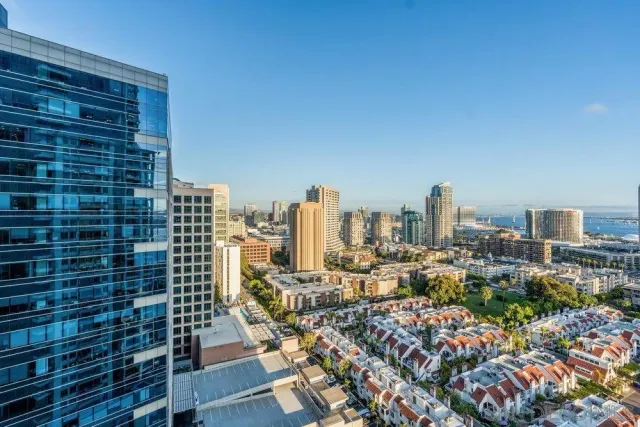 a view of a building and outdoor seating