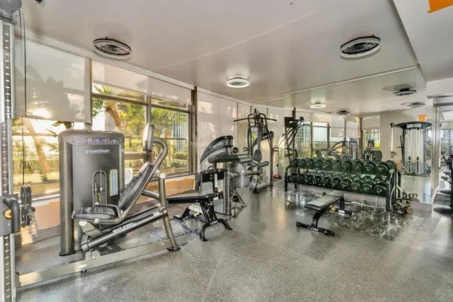 a building outdoor space with patio furniture and potted plants