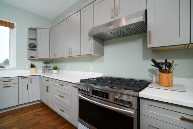 a bedroom with a bed and a fireplace