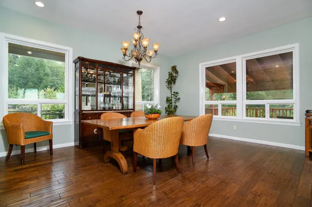 a bathroom with a toilet a sink and a mirror