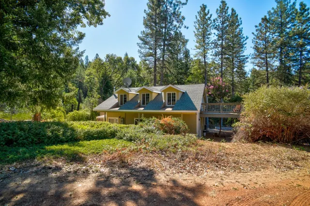 a kitchen with stainless steel appliances a sink and stove top oven