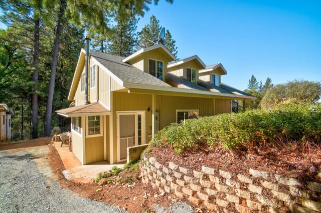 a kitchen with a sink cabinets and wooden floor