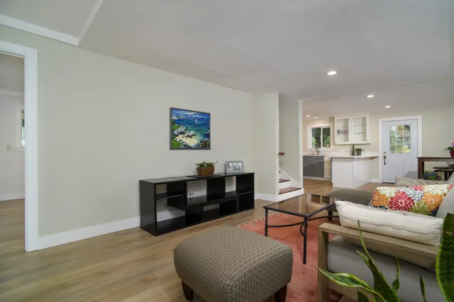 a bathroom with a toilet a sink a mirror and bathtub
