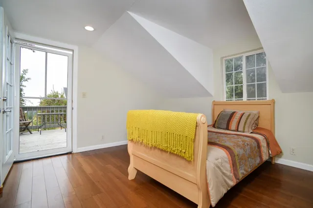 an aerial view of a house with a yard porch and furniture