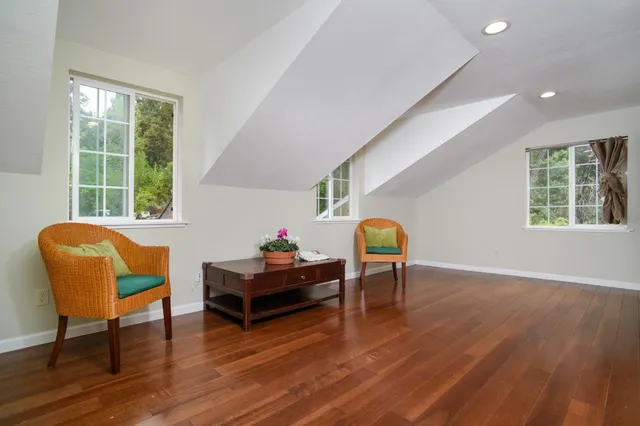 an aerial view of a house with a garden and swimming pool