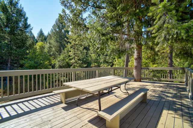 an aerial view of a house with a yard and garden