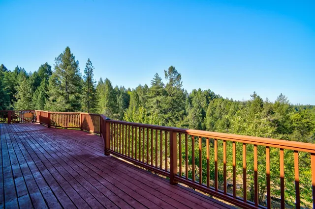 an aerial view of a house with yard swimming pool and outdoor seating