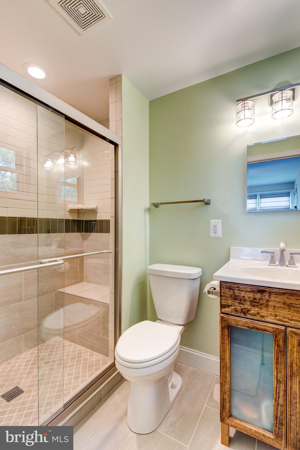 205 Meadowvale Road Lutherville-Timonium, MD 21093 - Photo 22 of 30 Full tiled shower with bench, custom vanity.
