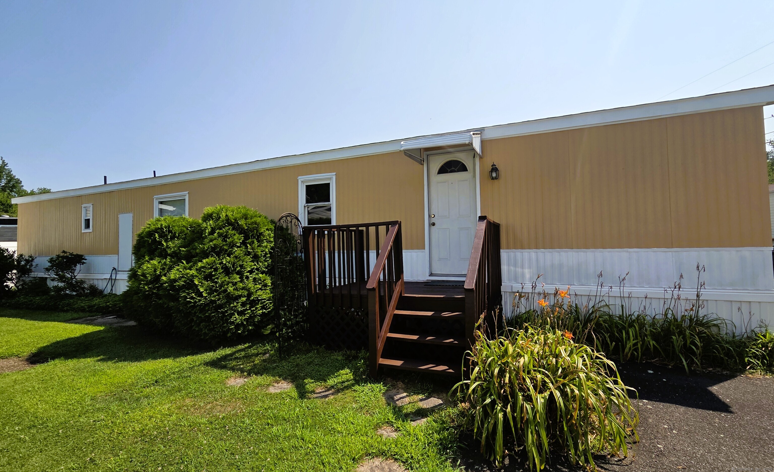 301 South Main Street Newtown, CT 06470 - Photo 1 of 11 a front view of a house with garden