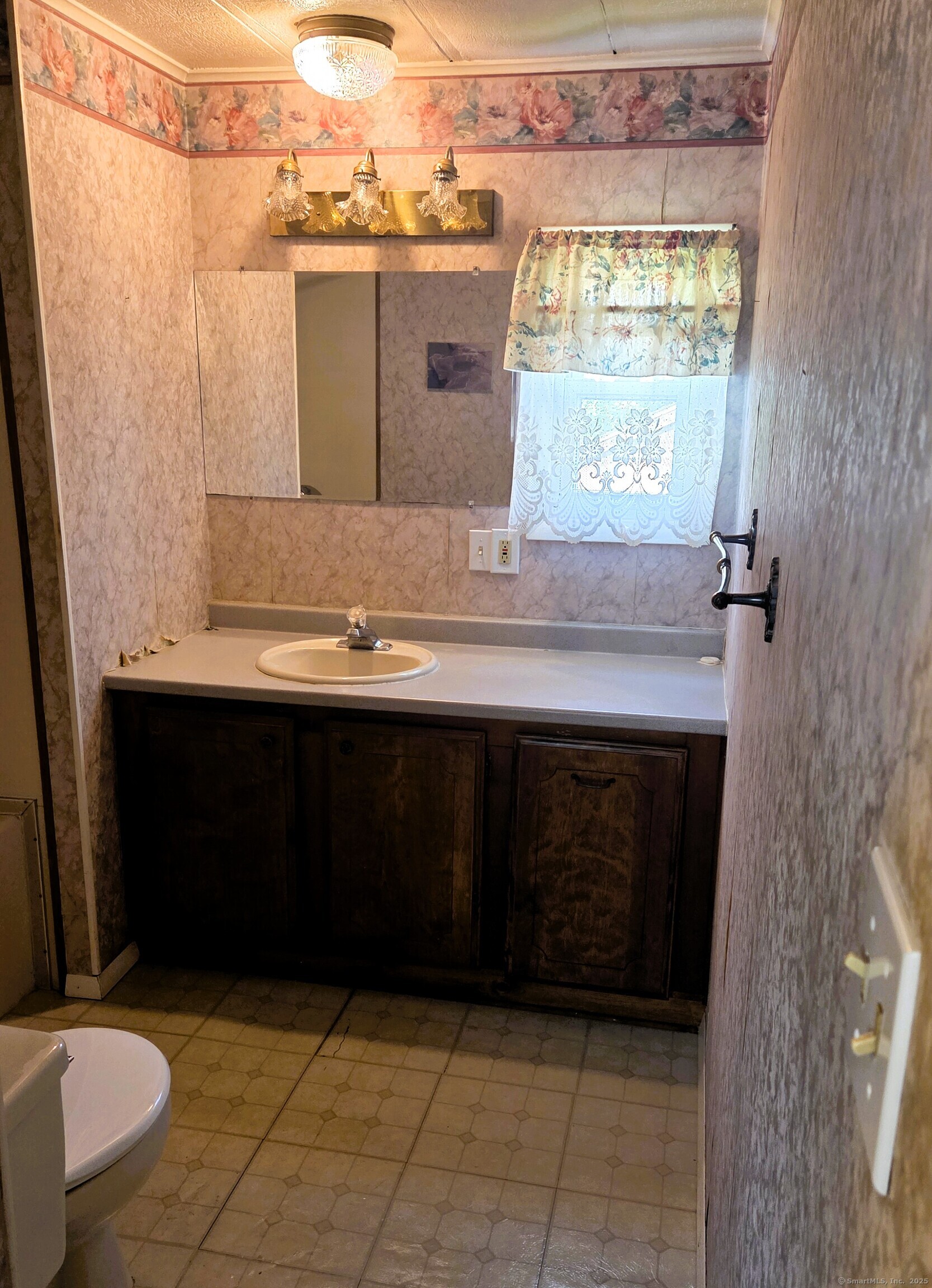 301 South Main Street Newtown, CT 06470 - Photo 11 of 11 a bathroom with a sink a toilet and a mirror