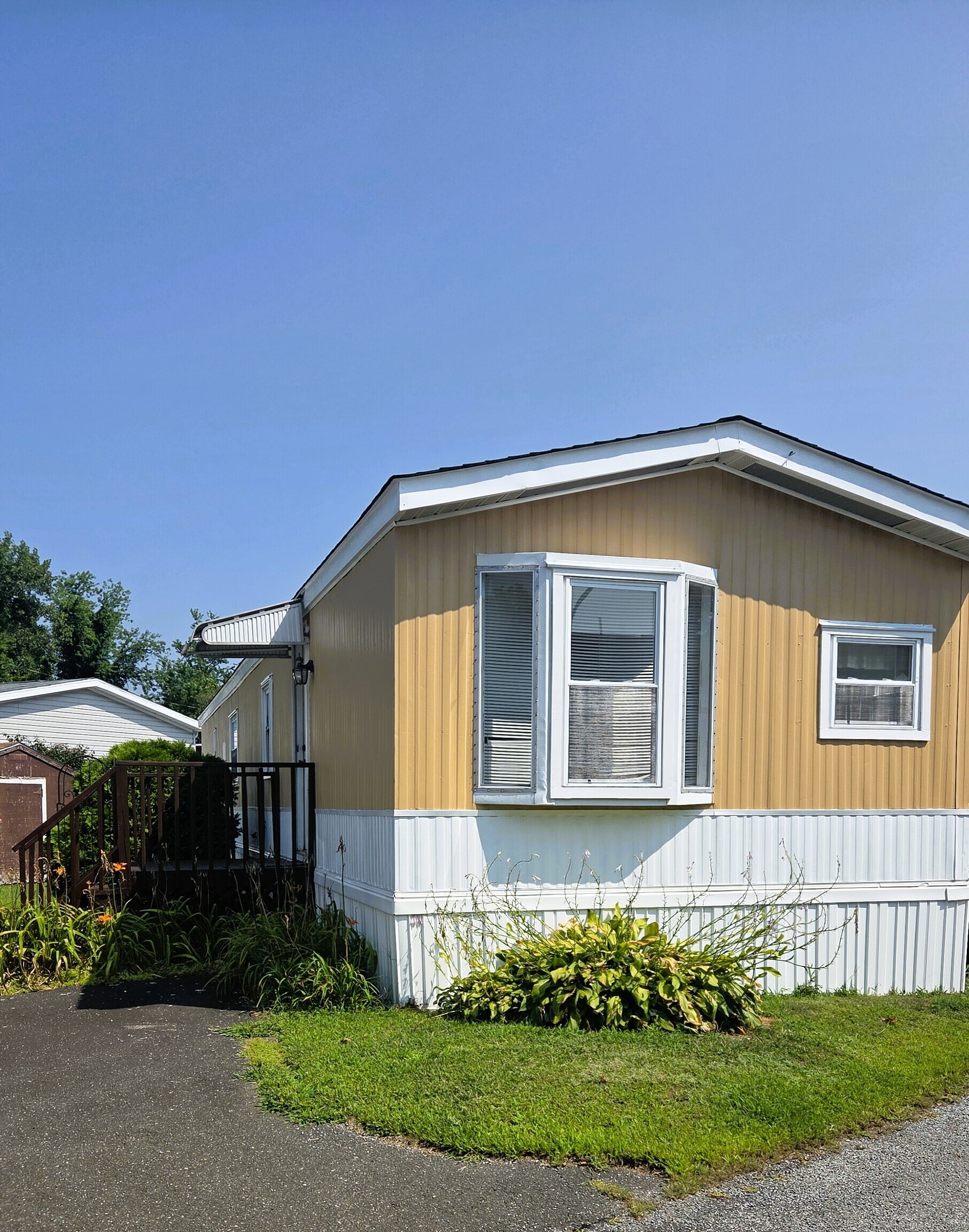 301 South Main Street Newtown, CT 06470 - Photo 2 of 11 a front view of a house with a garden