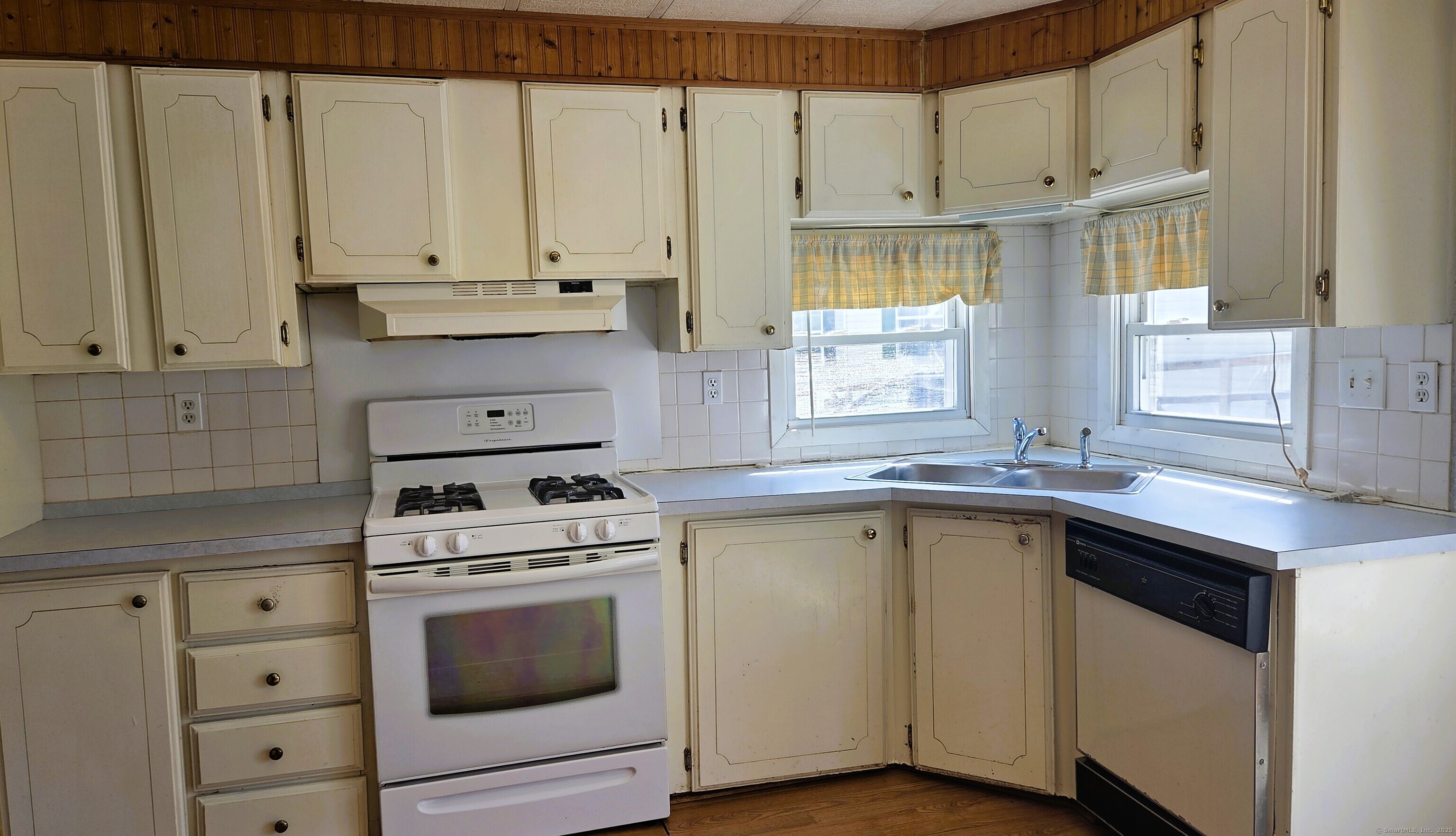 301 South Main Street Newtown, CT 06470 - Photo 4 of 11 a kitchen with appliances cabinets and a sink