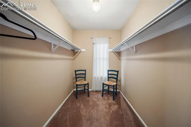 a view of room with window and sitting area