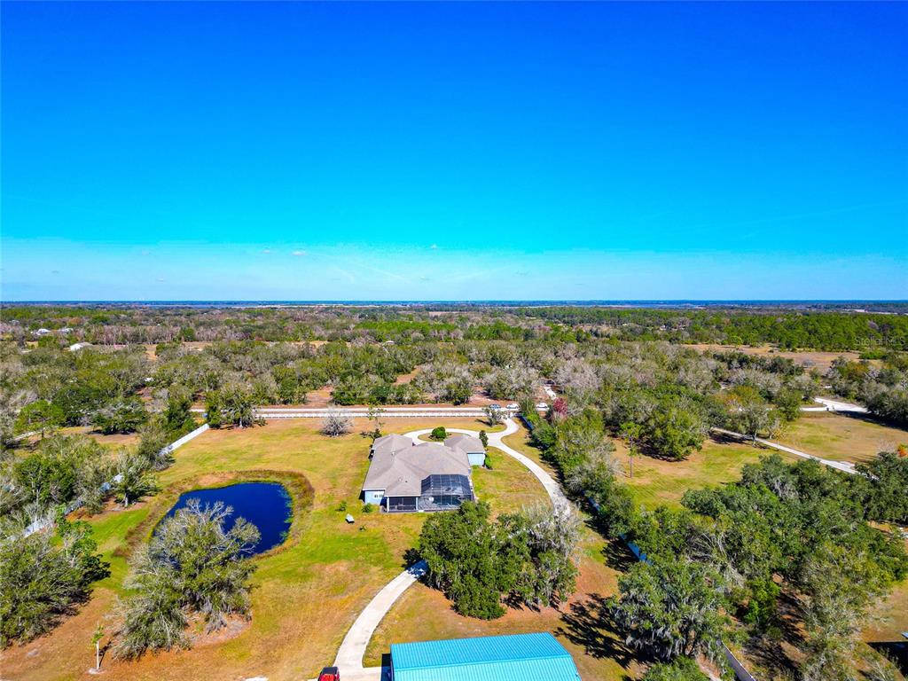 28154 Gopher Hill Road Myakka City, FL 34251 - Photo 14 of 100 an aerial view of residential building and ocean