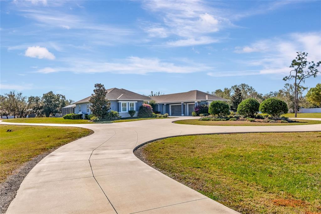 28154 Gopher Hill Road Myakka City, FL 34251 - Photo 23 of 100 a view of swimming pool with outdoor seating and garden