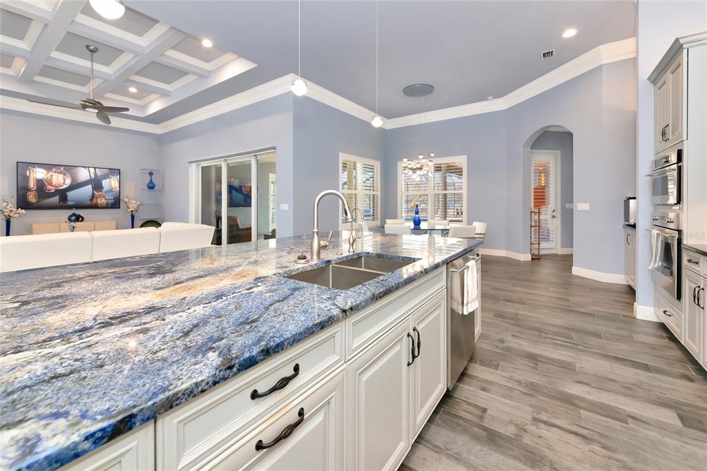 28154 Gopher Hill Road Myakka City, FL 34251 - Photo 34 of 100 a large kitchen with granite countertop a large counter top space and stainless steel appliances