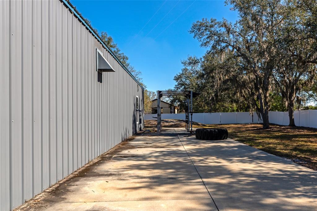 28154 Gopher Hill Road Myakka City, FL 34251 - Photo 56 of 100 a view of a house with backyard and trees