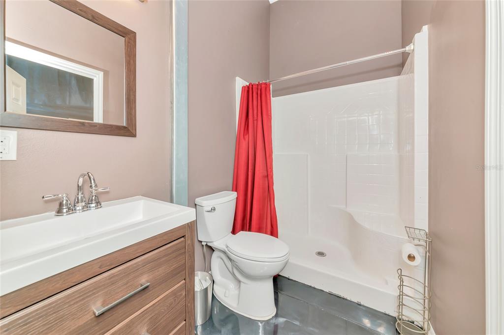 28154 Gopher Hill Road Myakka City, FL 34251 - Photo 57 of 100 a bathroom with a sink toilet and shower