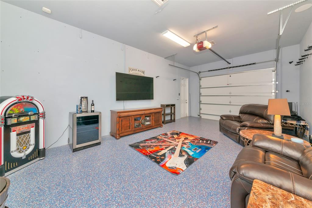 28154 Gopher Hill Road Myakka City, FL 34251 - Photo 67 of 100 a living room with furniture and a flat screen tv