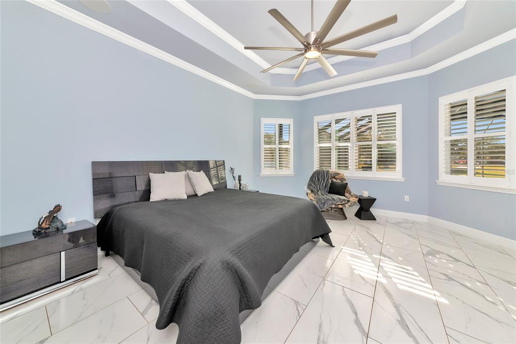 28154 Gopher Hill Road Myakka City, FL 34251 - Photo 69 of 100 a bedroom with a bed and wooden floor