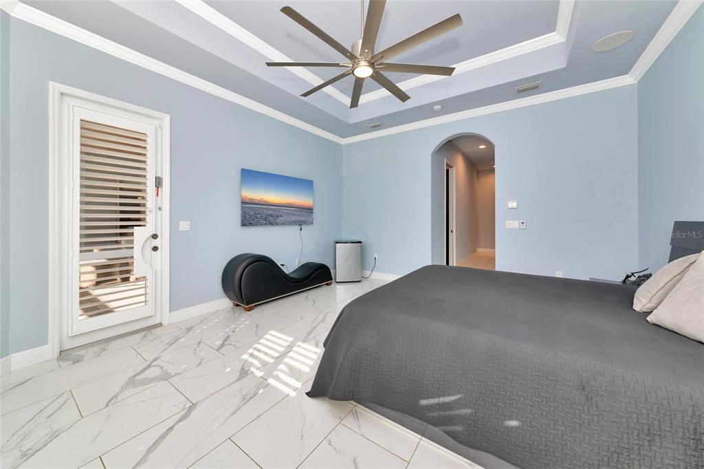 28154 Gopher Hill Road Myakka City, FL 34251 - Photo 78 of 100 a bedroom with a bed and a large window