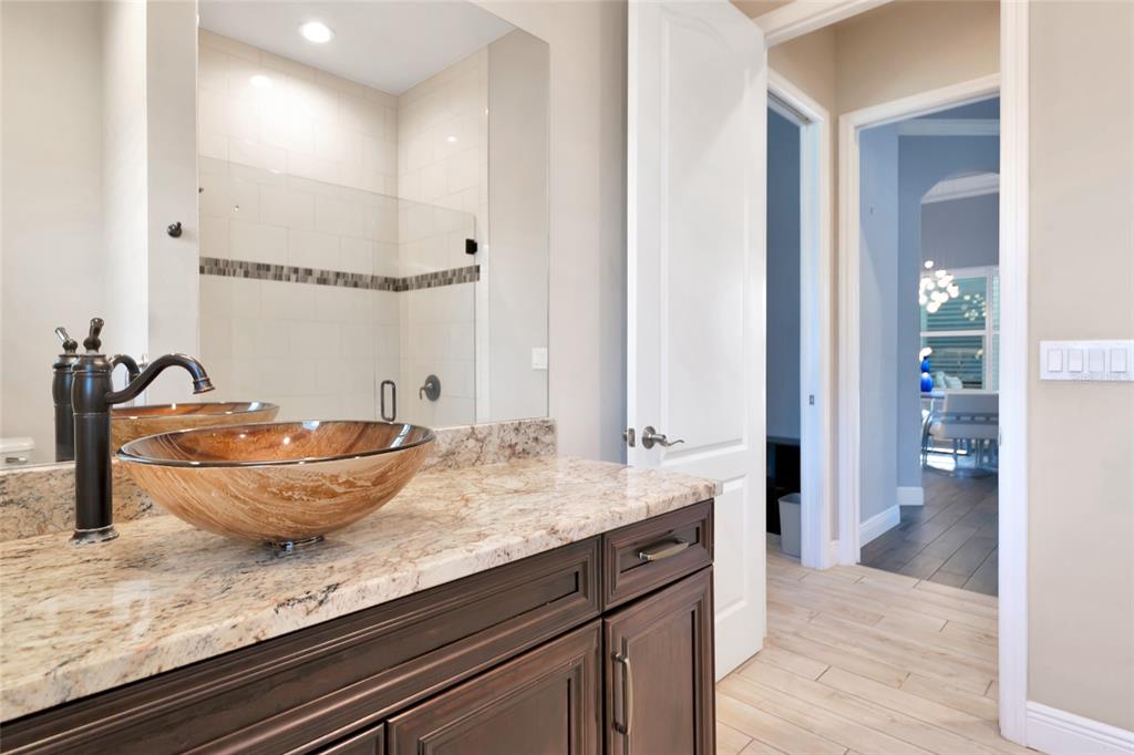 28154 Gopher Hill Road Myakka City, FL 34251 - Photo 91 of 100 a bath room with a sink and a mirror