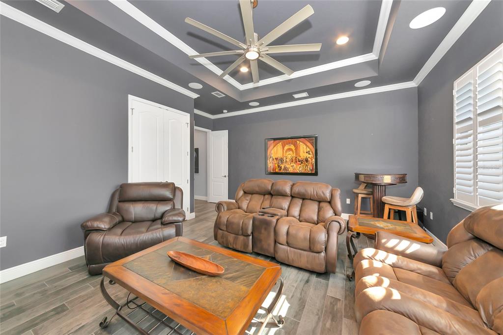 28154 Gopher Hill Road Myakka City, FL 34251 - Photo 95 of 100 a living room with furniture and a chandelier