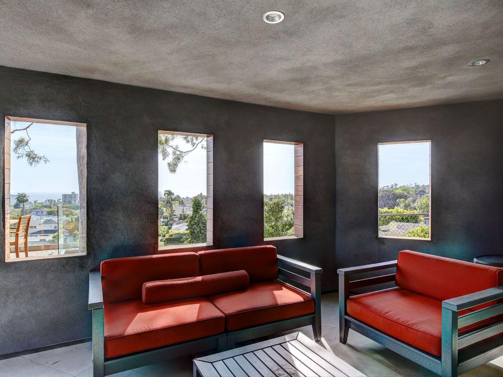 5038 Windsor Drive Pacific Beach, CA 92109 - Photo 31 of 33 a living room with furniture and a window