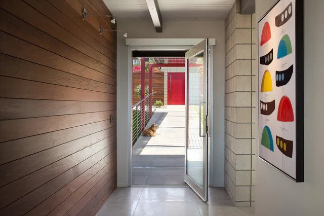 a bed room with a bed and a large window