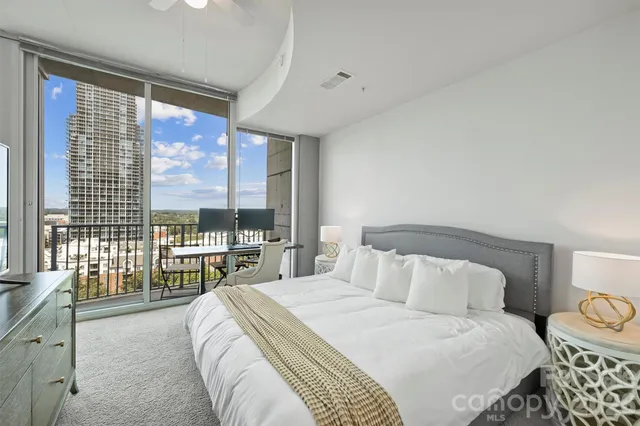 a bathroom with a granite countertop sink and a shower