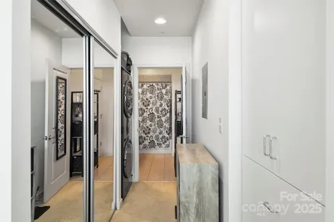a bathroom with a shower and a glass door