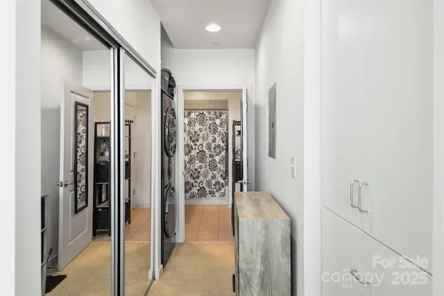 a bathroom with a shower and a glass door