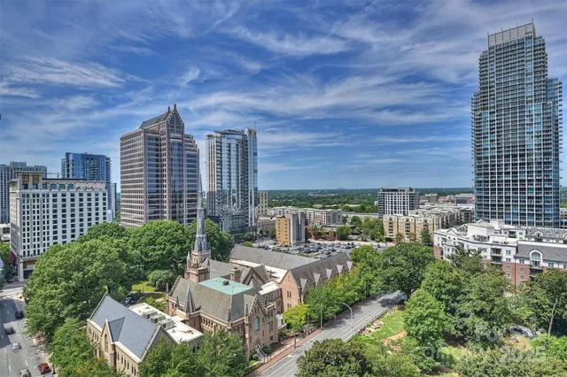 a view of a city with tall buildings