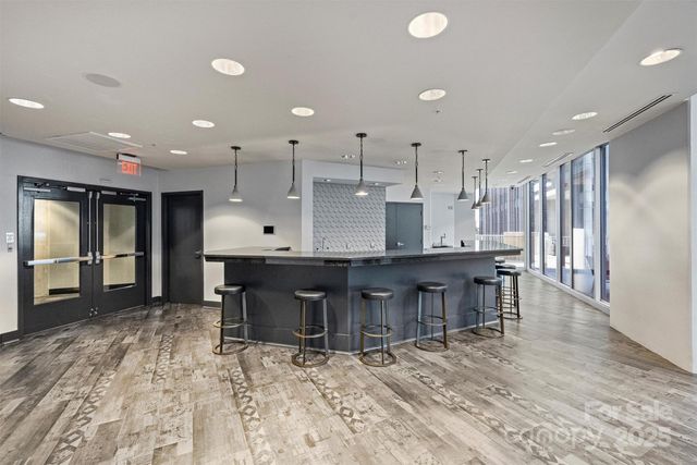 a large kitchen with a table and chairs