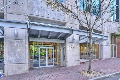 a front view of a building with a glass door and outdoor space