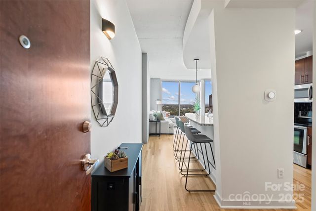 a living room with furniture and a mirror