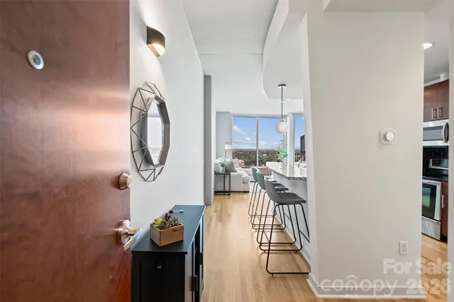 a kitchen with kitchen island a counter space a sink appliances and cabinets