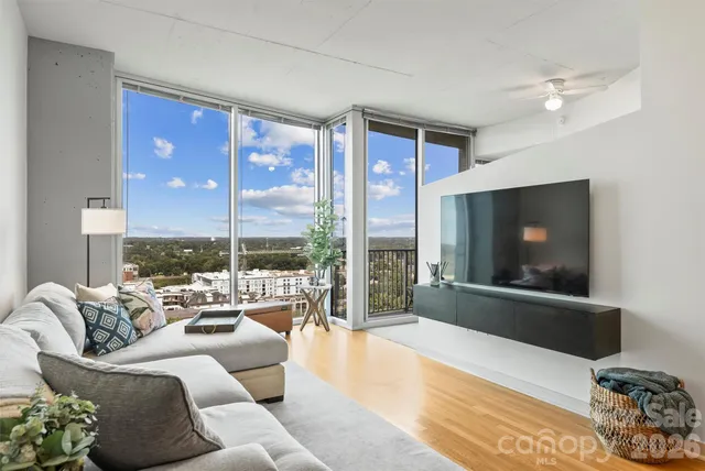 a living room with furniture and a flat screen tv