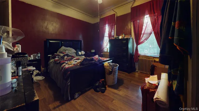 a bed sitting in a bedroom next to a window