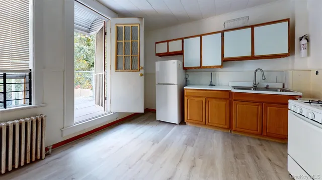 a kitchen with stainless steel appliances granite countertop a refrigerator sink and cabinets