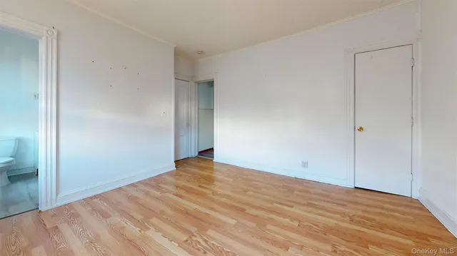 a kitchen with stainless steel appliances granite countertop a sink a stove cabinets and wooden floor