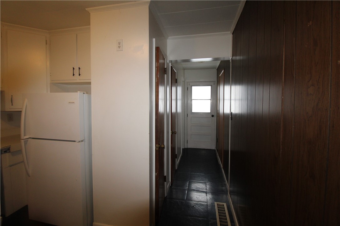 59 Griffith Street Corning, NY 14830 - Photo 10 of 25 Kitchen looking towards back door and bathroom on