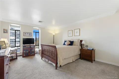 a bed room with a bed and furniture