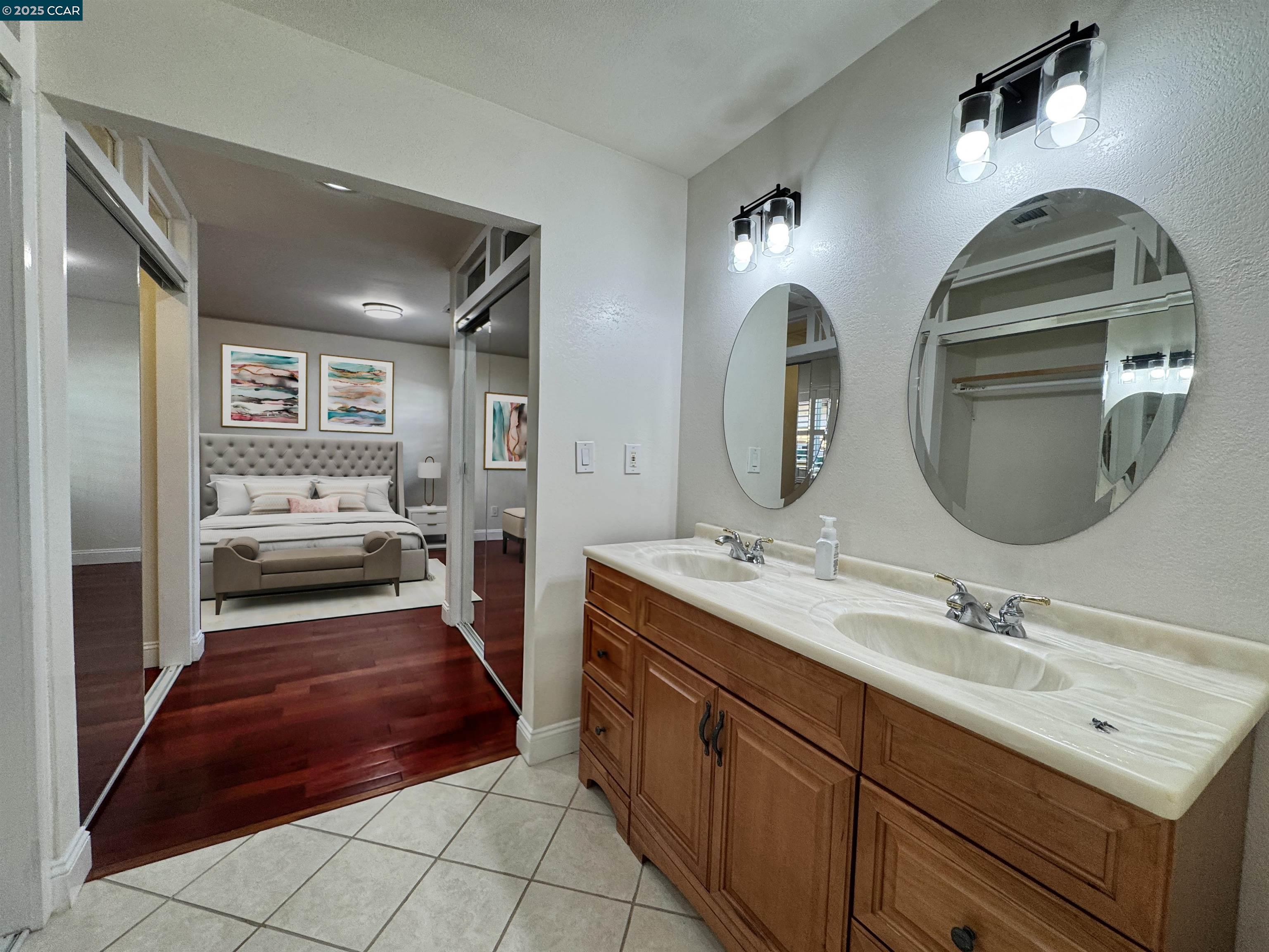 404 Coral Reef Road Alameda, CA 94501 - Photo 27 of 33 a bathroom with a double vanity sink and a mirror