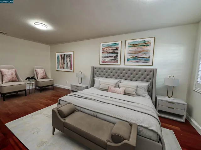 a bedroom with a bed and a couch