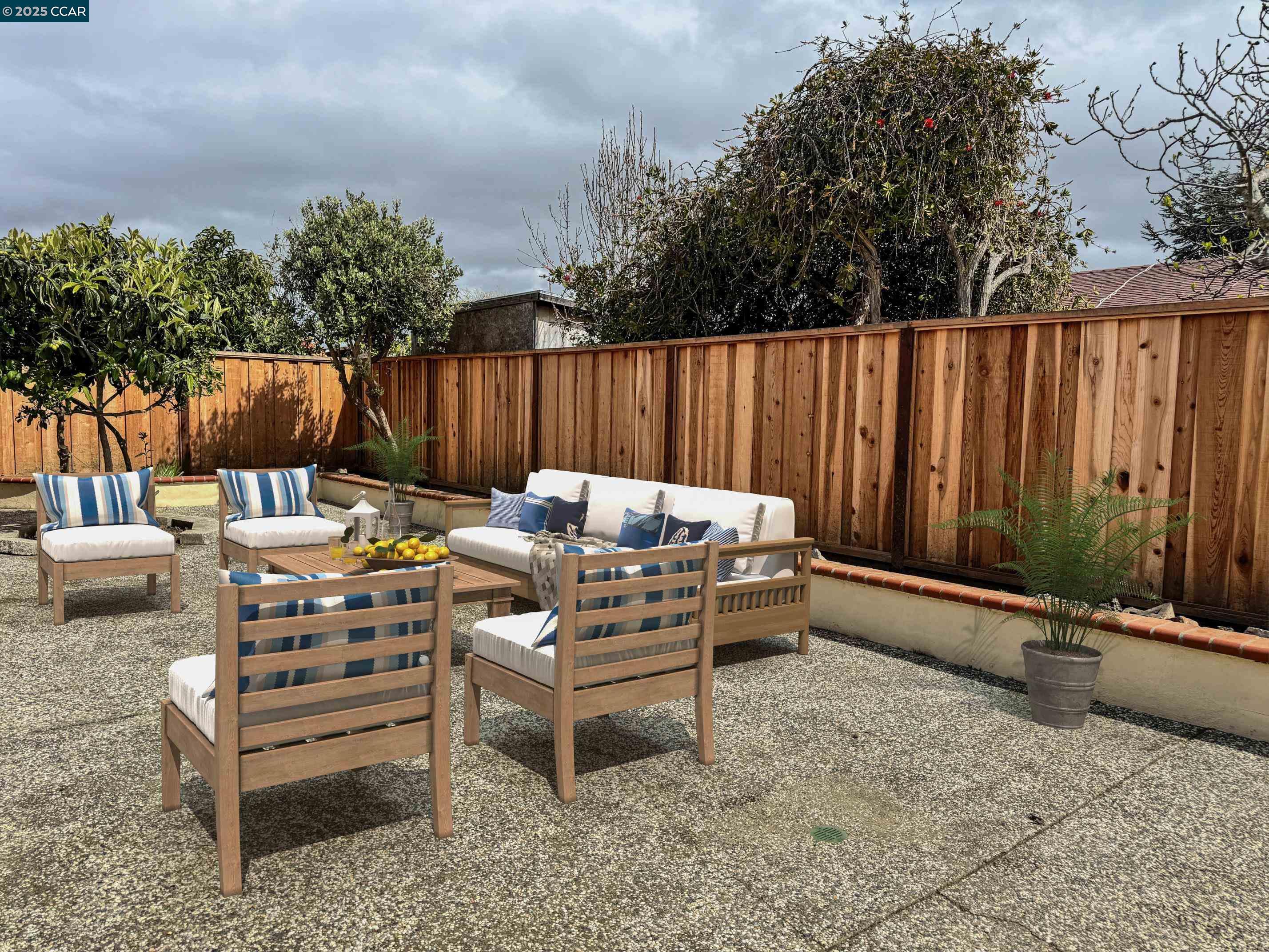 404 Coral Reef Road Alameda, CA 94501 - Photo 32 of 33 a backyard of a house with barbeque oven table and chairs