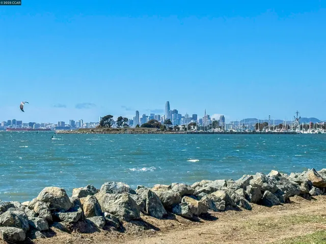a picture of a lake with houses