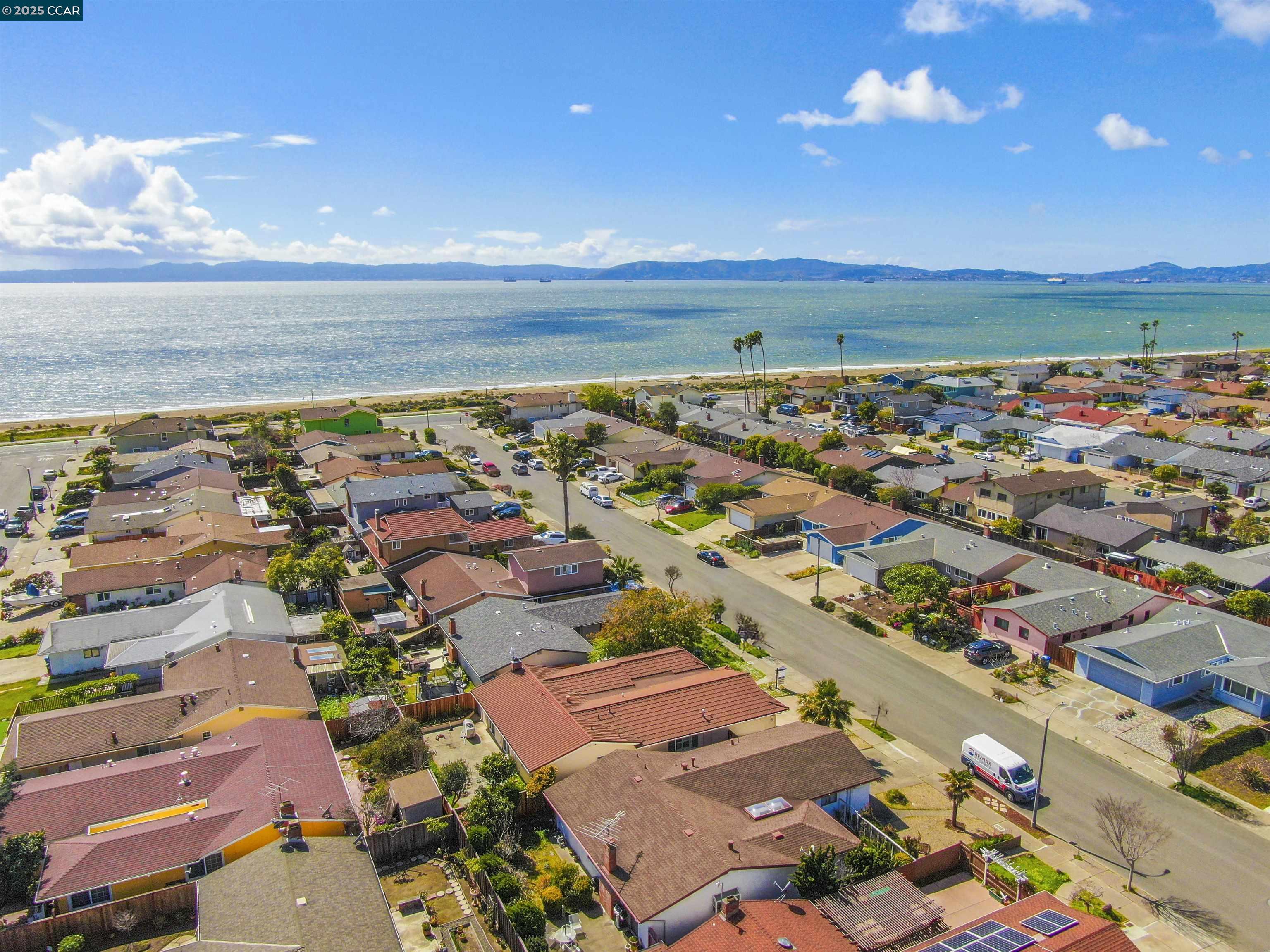 404 Coral Reef Road Alameda, CA 94501 - Photo 10 of 33 an aerial view of a city with lots of residential buildings and ocean view in back