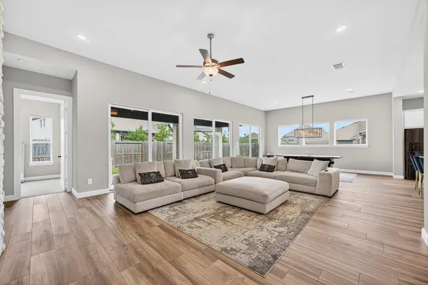 a dining room with furniture and chandelier